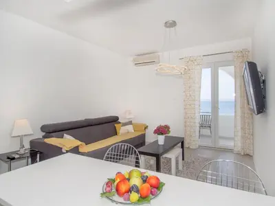 TV i/ili zabavni centar u objektu Villa Tamaris on the beach