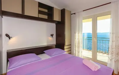 Krevet ili kreveti u jedinici u objektu Three-Bedroom Apartment Omis With Sea View 07