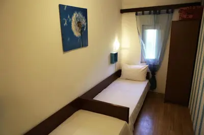 Krevet ili kreveti u jedinici u objektu Apartmani STANIĆ - Coastal Comfort Beach Apartments