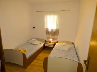 Krevet ili kreveti u jedinici u objektu Beachfront Apartments Plaža