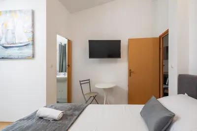 Krevet ili kreveti u jedinici u objektu Grey One Apartments