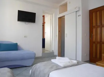Krevet ili kreveti u jedinici u objektu Dugi Rat Seaside Apartments