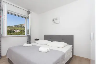 Krevet ili kreveti u jedinici u objektu Family friendly house with a swimming pool Srinjine, Split - 23770