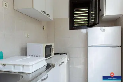 Kuhinja ili čajna kuhinja u objektu Apartments Rosemary