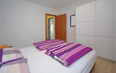 Krevet ili kreveti u jedinici u objektu Two-Bedroom Apartment Makarska With Sea View 06