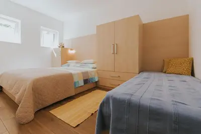 Krevet ili kreveti u jedinici u objektu First Row Seafront Apartments in Stanići