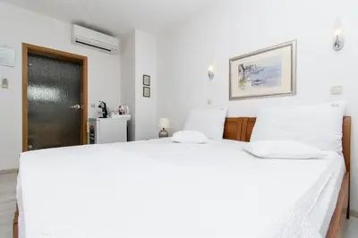 Krevet ili kreveti u jedinici u objektu Apartment and Rooms Ana