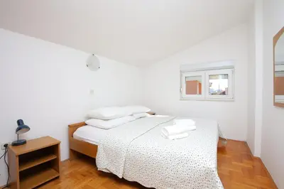 Krevet ili kreveti u jedinici u objektu Family friendly seaside apartments Podstrana - Split - 23954