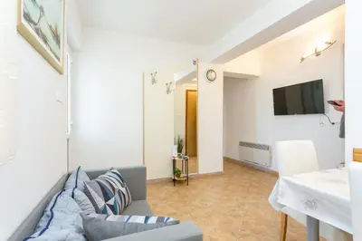 TV i/ili zabavni centar u objektu Apartment Postira 2948b