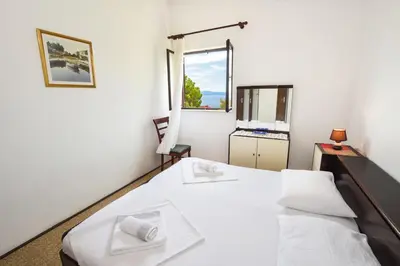 Krevet ili kreveti u jedinici u objektu Apartments by the sea Marusici, Omis - 10012