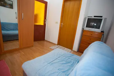 Krevet ili kreveti u jedinici u objektu Deluxe Apartment Mrnjica with a private parking, terrace and sea view