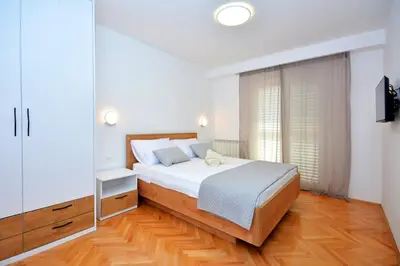 Krevet ili kreveti u jedinici u objektu Apartments Radeljić