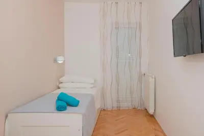 Krevet ili kreveti u jedinici u objektu Apartments Radeljić