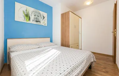 Krevet ili kreveti u jedinici u objektu Three-Bedroom Apartment With Sea View In Baska Voda