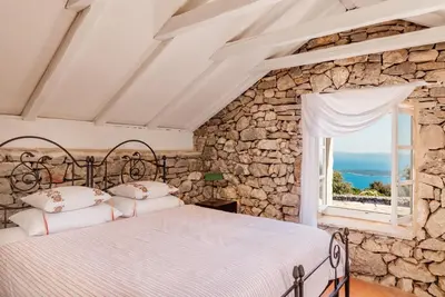 Krevet ili kreveti u jedinici u objektu Sea View Villa with Tennis Court - Dvori sv Jurja