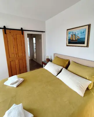 Krevet ili kreveti u jedinici u objektu Apartment on the beach Perla Bianca