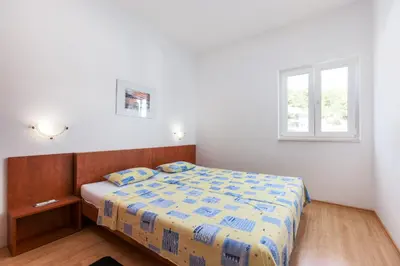 Krevet ili kreveti u jedinici u objektu Apartments Ksenija