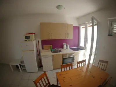 Kuhinja ili čajna kuhinja u objektu Apartments and Rooms Špiro