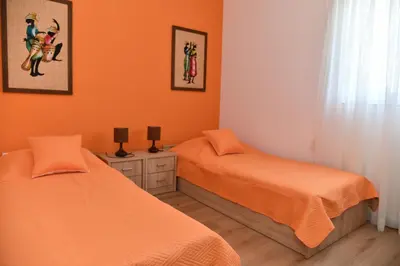 Krevet ili kreveti u jedinici u objektu Apartments Mandalena with terrace, 1 min walk to the beach