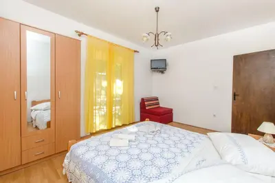 Krevet ili kreveti u jedinici u objektu Apartments and Rooms Stjepan