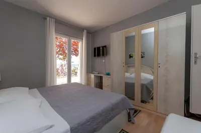 Krevet ili kreveti u jedinici u objektu Apartment and Rooms Tatijana