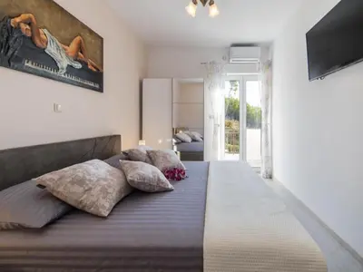 Krevet ili kreveti u jedinici u objektu Apartments Tafra - One Bedroom Apartment