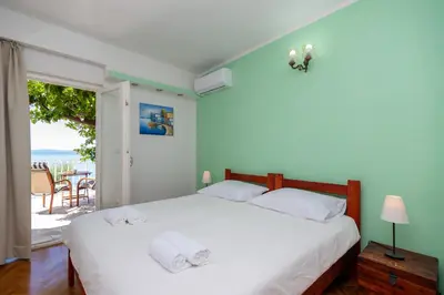 Krevet ili kreveti u jedinici u objektu Beachfront rooms Adriatic with breakfast