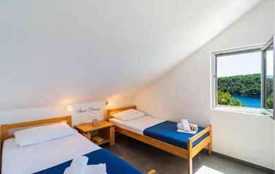 Krevet ili kreveti u jedinici u objektu Amazing Apartment In Milna With House Sea View
