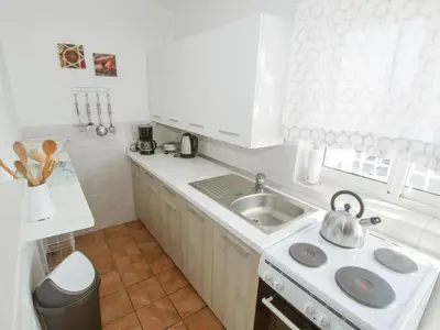 Kuhinja ili čajna kuhinja u objektu Apartments and Rooms Villa Dona