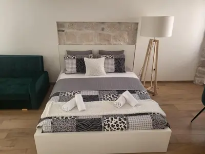 Krevet ili kreveti u jedinici u objektu Old town Bol apartments