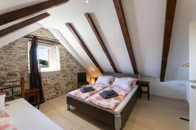 Krevet ili kreveti u jedinici u objektu Holiday House Tramonto with Pool, Sunset View & Pet Friendly, Donji Humac, Brač