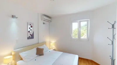 Krevet ili kreveti u jedinici u objektu Apartments Andrea - Beachfront & Sea-view Terrace