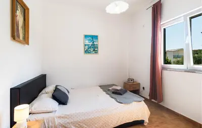 Krevet ili kreveti u jedinici u objektu Lovely Apartment In Omis With House Sea View
