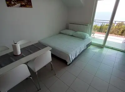 Krevet ili kreveti u jedinici u objektu Berti Sun & Sea Apartments
