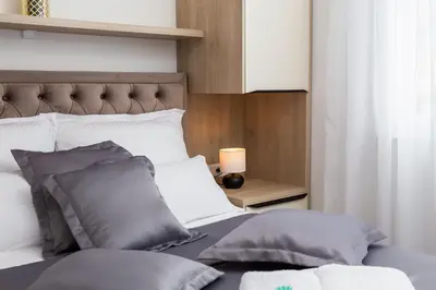 Krevet ili kreveti u jedinici u objektu La Suite Apartment