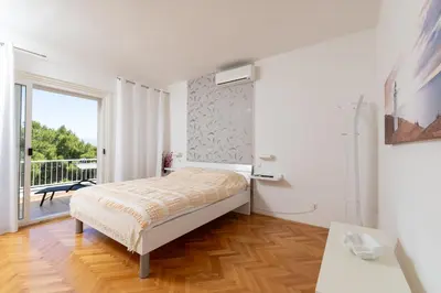Krevet ili kreveti u jedinici u objektu Apartments Dobronic