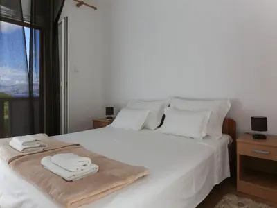 Krevet ili kreveti u jedinici u objektu Apartment Komplett ausgestattete Wohnung für 7 Personen by Interhome