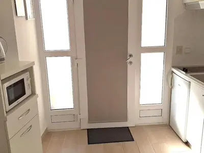 Kuhinja ili čajna kuhinja u objektu Apartment Wohnung mit Balkon und Meerblick in Strandnähe by Interhome