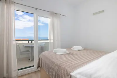 Krevet ili kreveti u jedinici u objektu Apartments with parking space Makarska - 6632