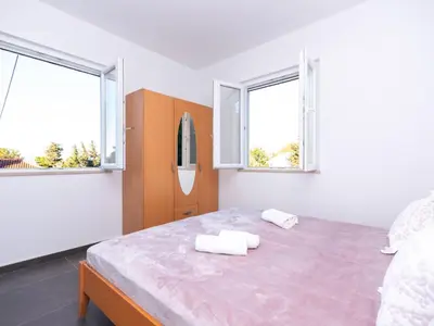 Krevet ili kreveti u jedinici u objektu Holiday Home Haus in Splitska mit kostenlosem Parkplatz by Interhome
