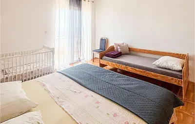 Krevet ili kreveti u jedinici u objektu Cozy Apartment In Necujam With House Sea View