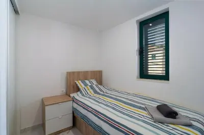Krevet ili kreveti u jedinici u objektu Apartments Seafront Paradise