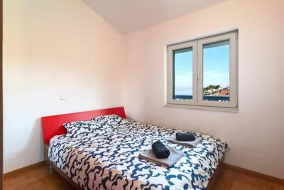 Krevet ili kreveti u jedinici u objektu Apartments Seafront Paradise