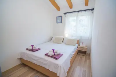 Krevet ili kreveti u jedinici u objektu Family-friendly apartments with swimming pool Kostanje, Omis - 25072