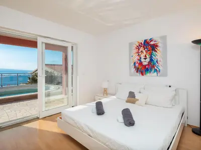 Krevet ili kreveti u jedinici u objektu Holiday Home für 12 Personen in Stanići- Dalmatien - Mitteldal by Interhome