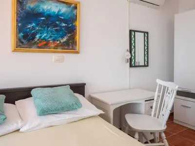 Krevet ili kreveti u jedinici u objektu Holiday Home Mirabilis - Privates Strandhaus by Interhome