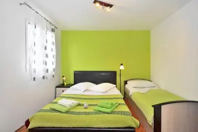 Krevet ili kreveti u jedinici u objektu Three bedded room with an outdoor kitchen