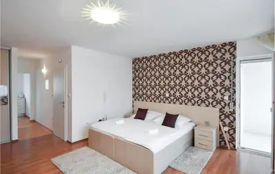 Krevet ili kreveti u jedinici u objektu Cozy Apartment In Podstrana With House Sea View
