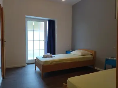 Krevet ili kreveti u jedinici u objektu Holiday Home with free parking by the beach