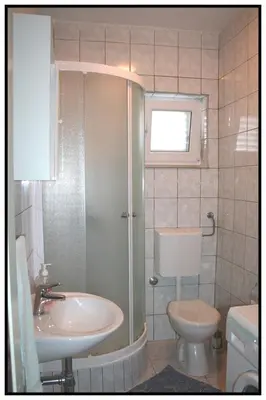 Kupaonica u objektu Apartments with a parking space Podstrana, Split - 5250